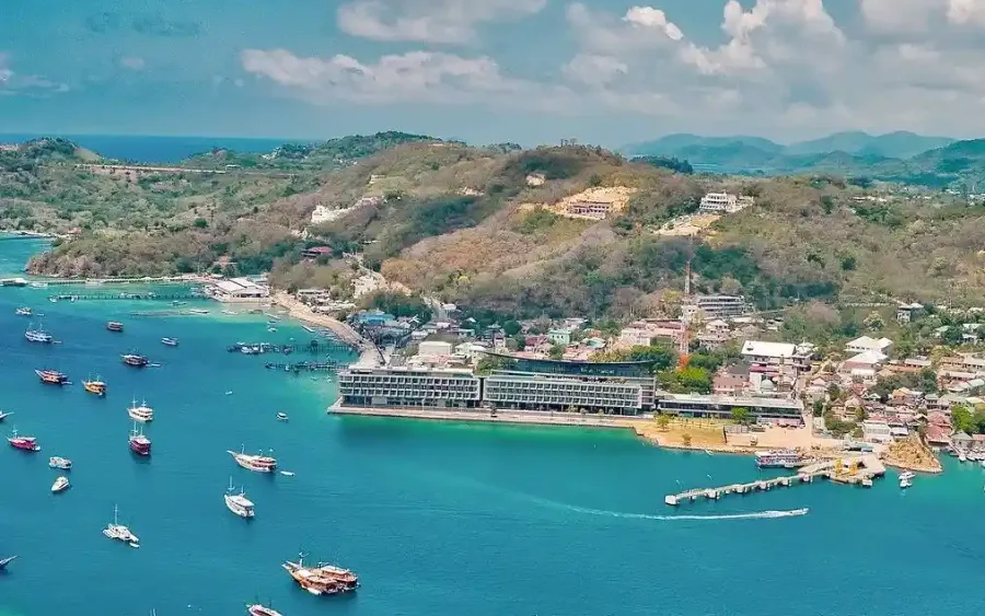Aerial view of Labuan Bajo harbour with the tour fleet at anchor