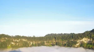One of the Kelimutu crater lakes covered by mist, Kelimutu National Park