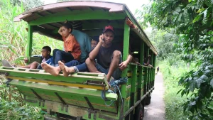 A local public bus on a road in Flores